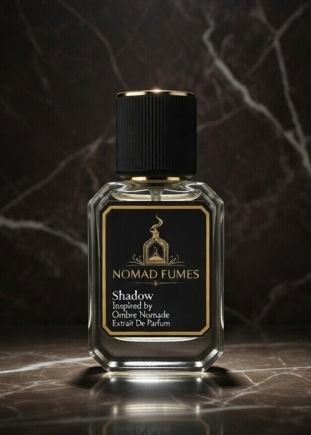 Perfume bottle labeled 'Nomad Fumes' on a dark marble surface