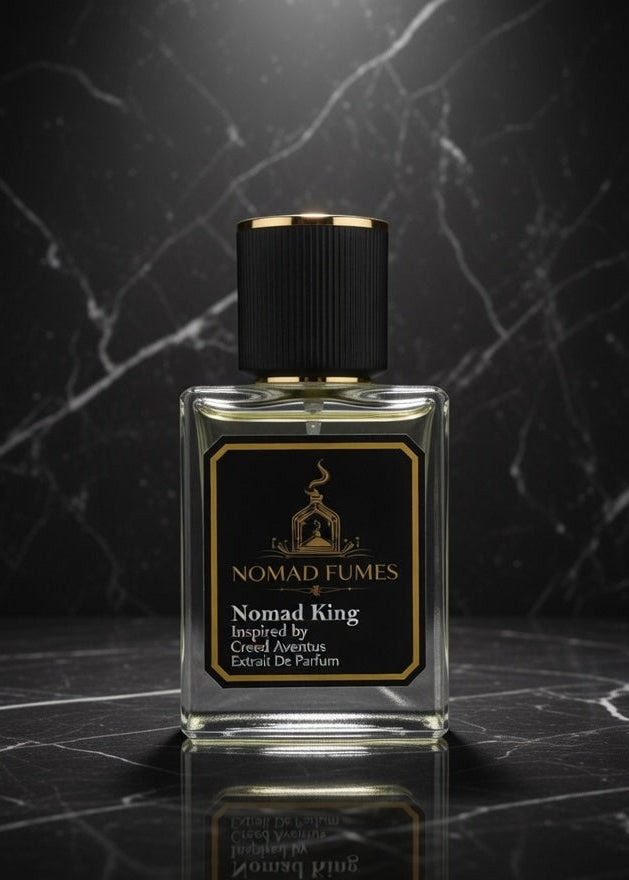Perfume bottle labeled 'Nomad Fumes' on a dark marble surface
