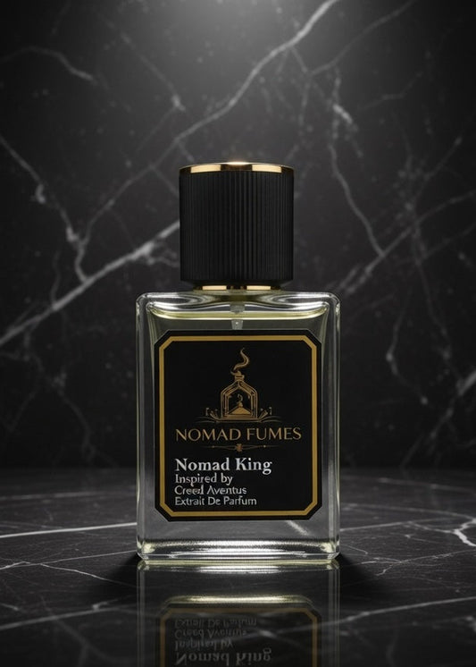 Perfume bottle labeled 'Nomad Fumes' on a dark marble surface