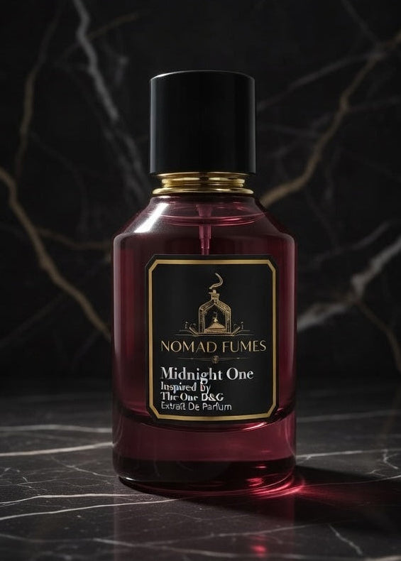 Bottle of Nomad Tumis Midnight One perfume on a dark marble background