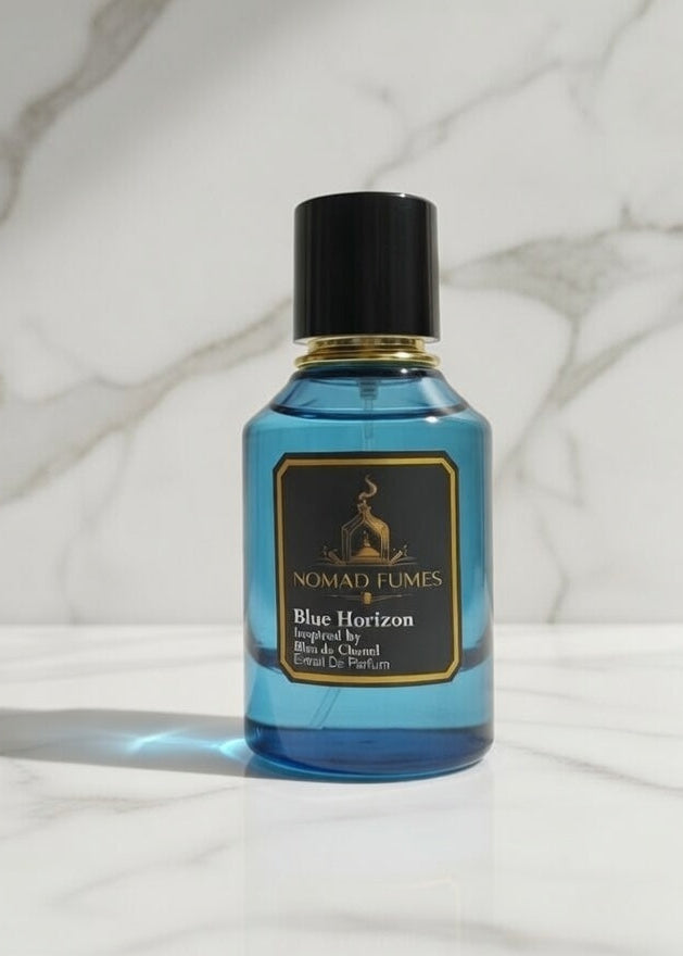 Blue bottle with black cap on a marble surface