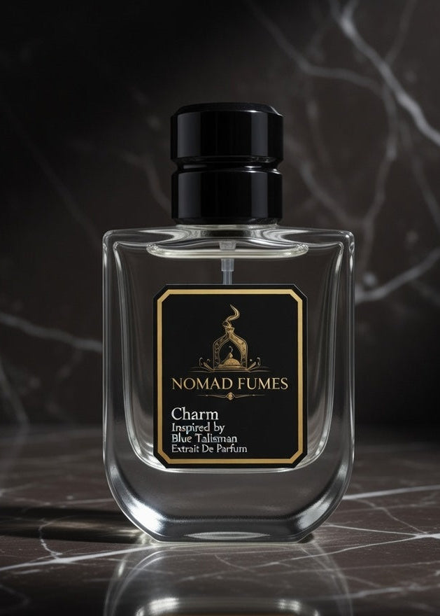 Perfume bottle labeled 'Nomad Lumes' on a dark marble surface