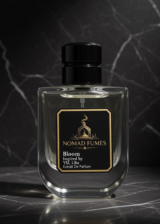 Nomad Fumes perfume bottle on a dark marble surface